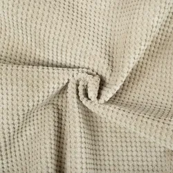 Pouf beige élégant, idéal pour les espaces de vie ou les chambres