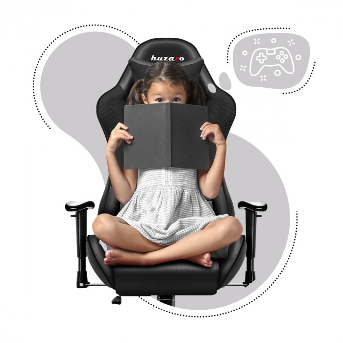 Enfant assis avec un livre sur la chaise pour enfants Huzaro Ranger 6.0 Black