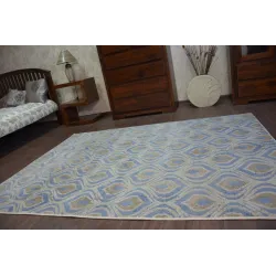 Tapis DROP JASMINE 030 en nuances de bleu, idéal pour un intérieur contemporain