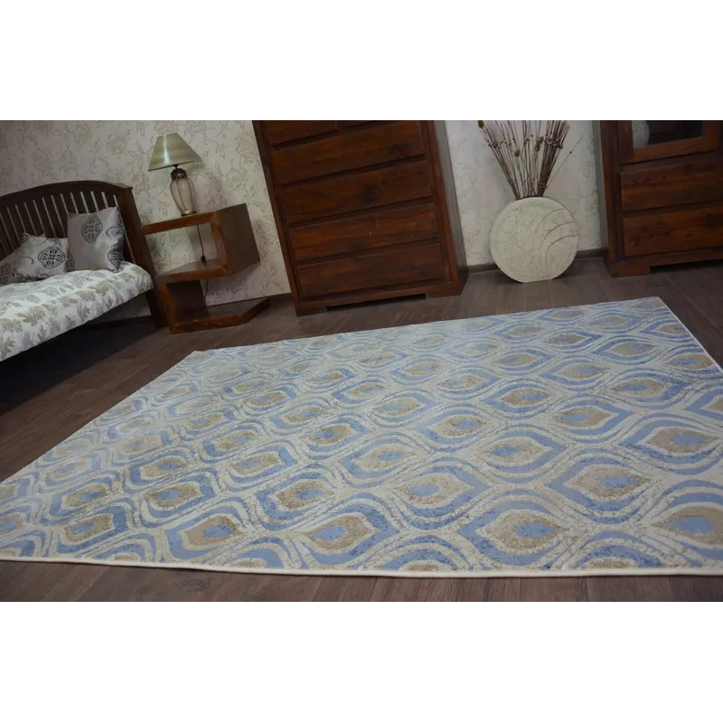 Tapis DROP JASMINE 030 en nuances de bleu, idéal pour un intérieur contemporain