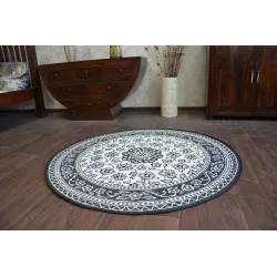 Tapis rond en sisal avec texture lisse, parfait pour la chambre