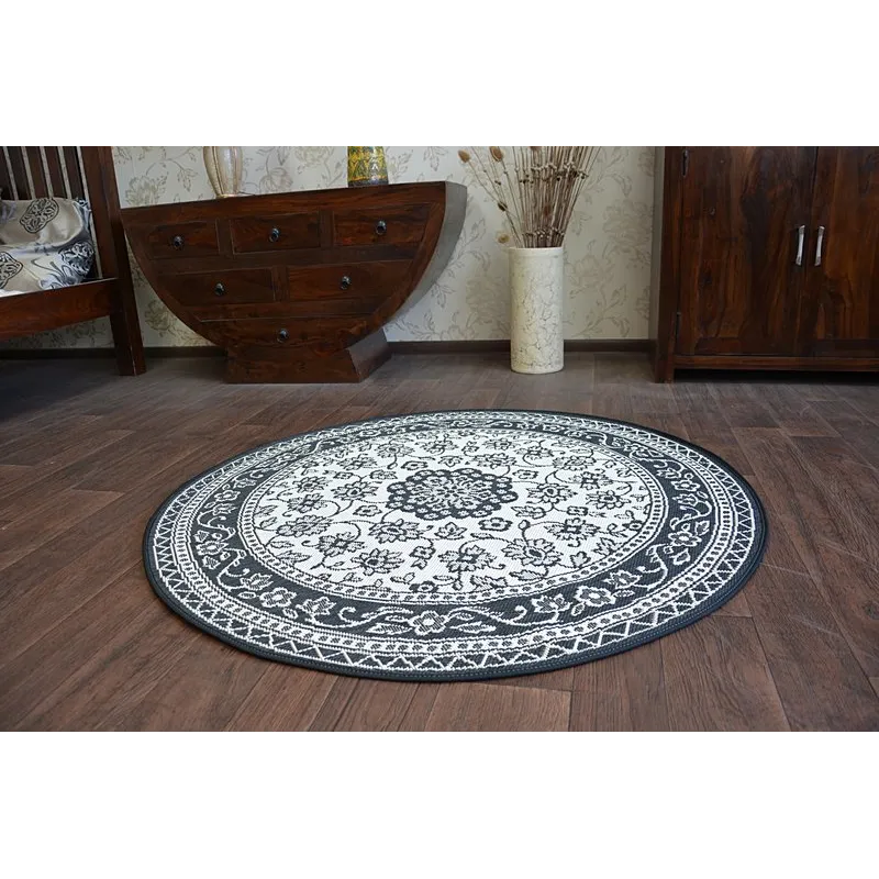 Tapis rond en sisal avec texture lisse, parfait pour la chambre