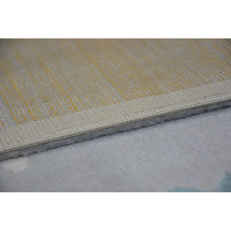 Tapis de jardin en gris et crème avec accents turquoise