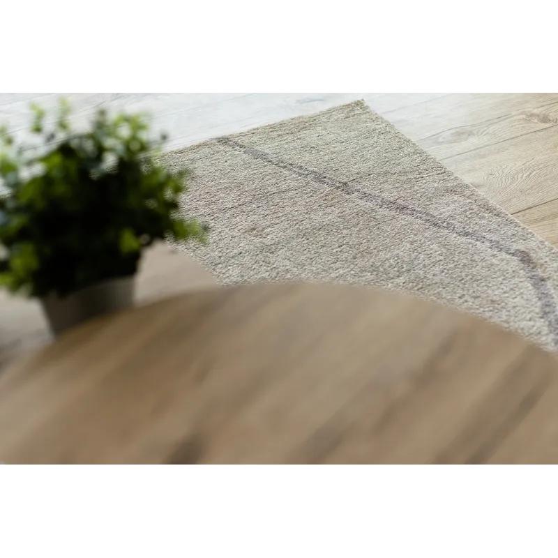 Tapis crème avec motif ethnique, parfait pour des intérieurs modernes