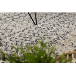 Tapis circulaire crème et gris, idéal pour le salon
