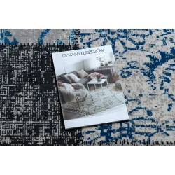 Tapis élégant gris et bleu, parfait pour tout intérieur