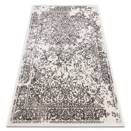Tapis vintage beige avec motif classique de rosette, idéal pour le salon