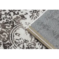 Tapis vintage doux beige, idéal pour les chambres à coucher