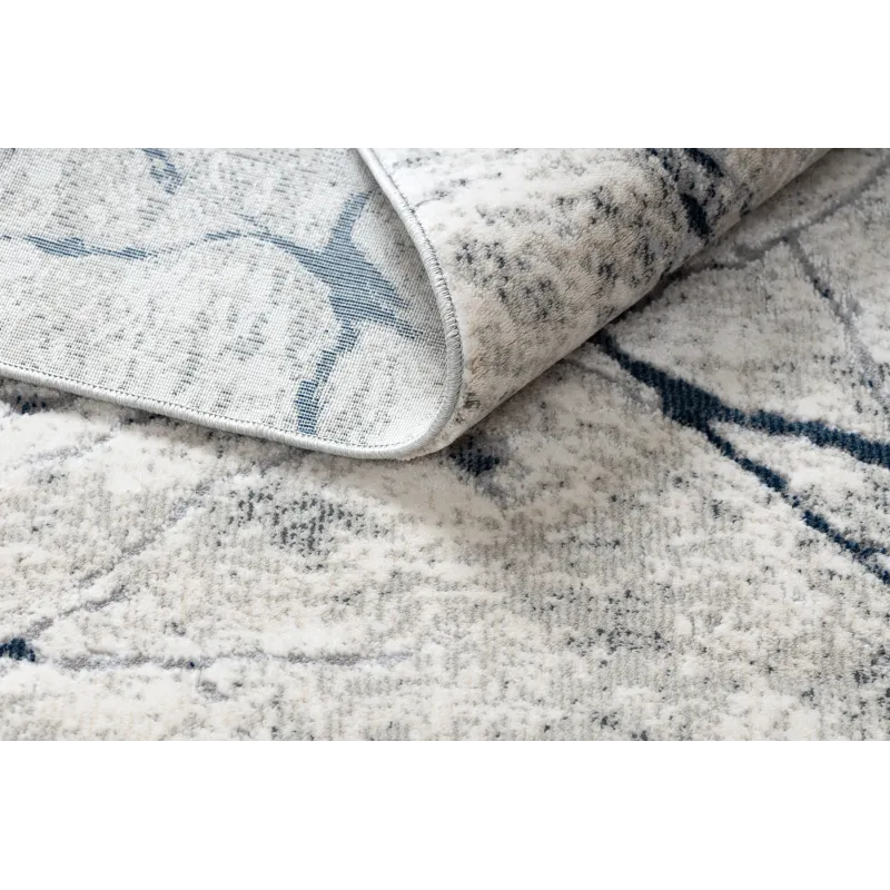 Tapis moderne REBEC avec franges, idéal pour décorer un jardin ou une terrasse