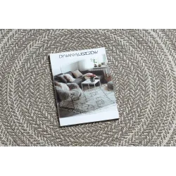 Tapis rond en sisal beige, parfait pour des intérieurs modernes