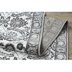 Tapis structuré gris avec fleurs pour la chambre