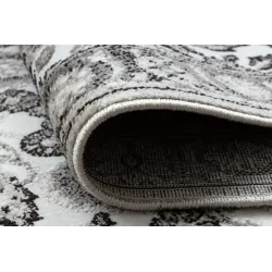 Tapis confortable gris et beige, adapté à tous les intérieurs