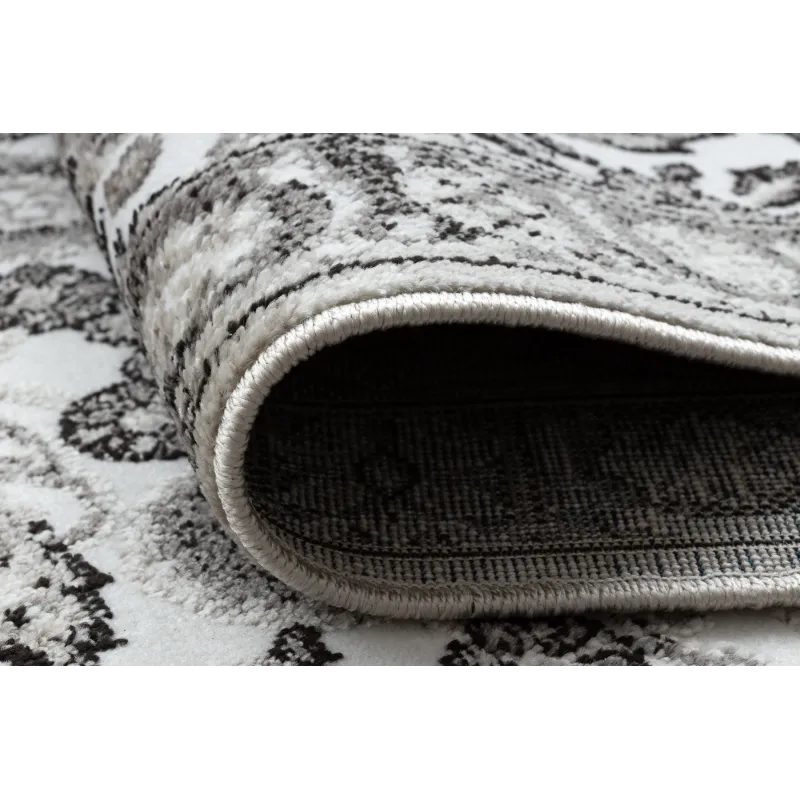 Tapis confortable gris et beige, adapté à tous les intérieurs