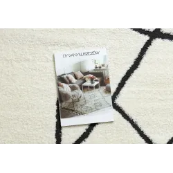 Tapis abstrait crème et noir, parfait pour les espaces contemporains