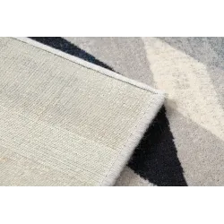 Tapis doux en laine, parfait pour apporter confort à la chambre