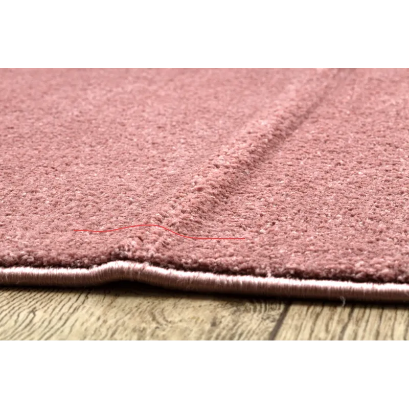Tapis rose doux, parfait pour la décoration du salon