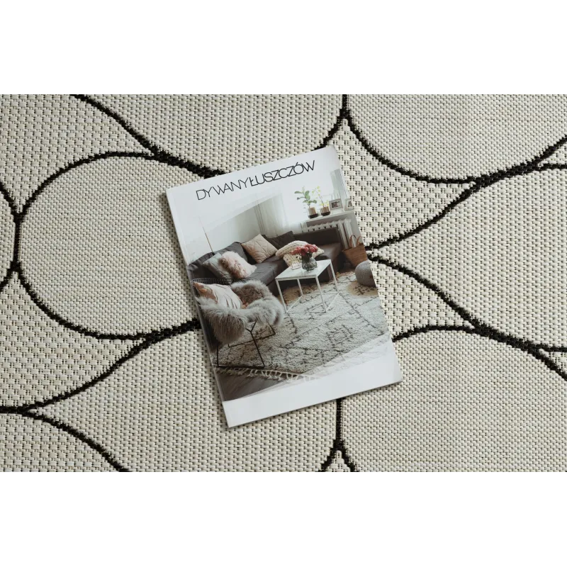 Tapis élégant en crème et noir, idéal pour le salon