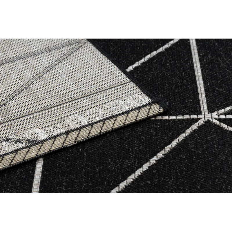 Tapis en sisal texturé noir et argent, ajoutant de l'élégance à n'importe quel espace